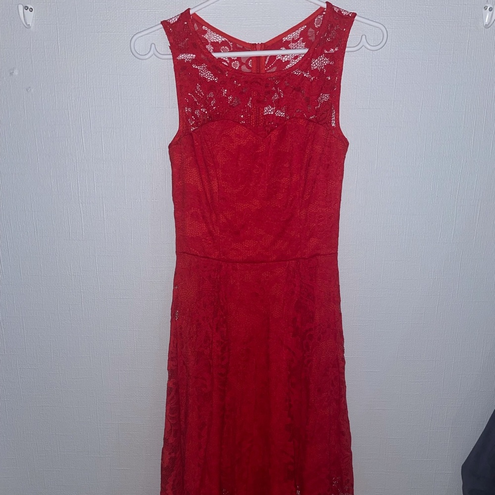 Cute red dress with floral lace details.